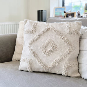 Natural tufted cushion