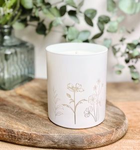 White candle jar, engraved spring time flower design.