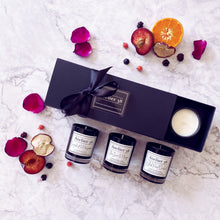 Load image into Gallery viewer, Black Gift Box of 3 votive candles in Fruity and sweet scents. Natural sustainable soy wax. Grapefruit &amp; Mangosteen. Thai Lime &amp; Mango. Black Pearl Orchid. 
