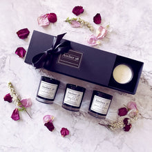 Load image into Gallery viewer, Black gift box of 3 votives. Floral scents: Jasmine &amp; Gardenia; Peony &amp; Oud; Bergamot, Verbena &amp; Basil.
